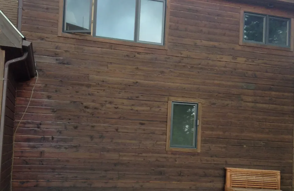 Cedar siding on a mountain home Tall Pines stained