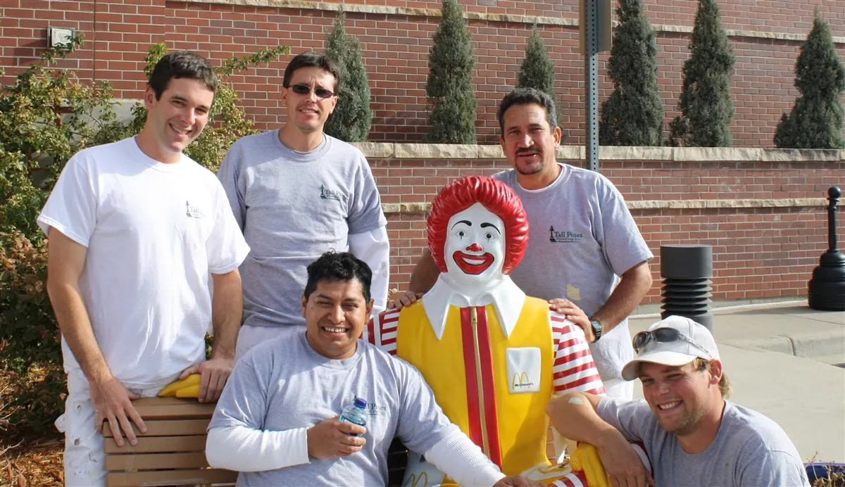 Tall Pines crew members with Ronald McDonald on a charity painting project