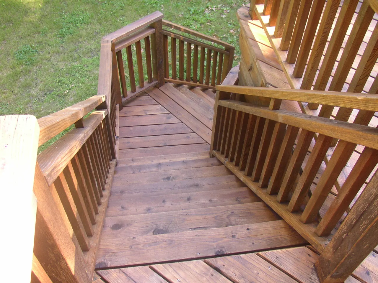 Stained wood deck stairs and railings