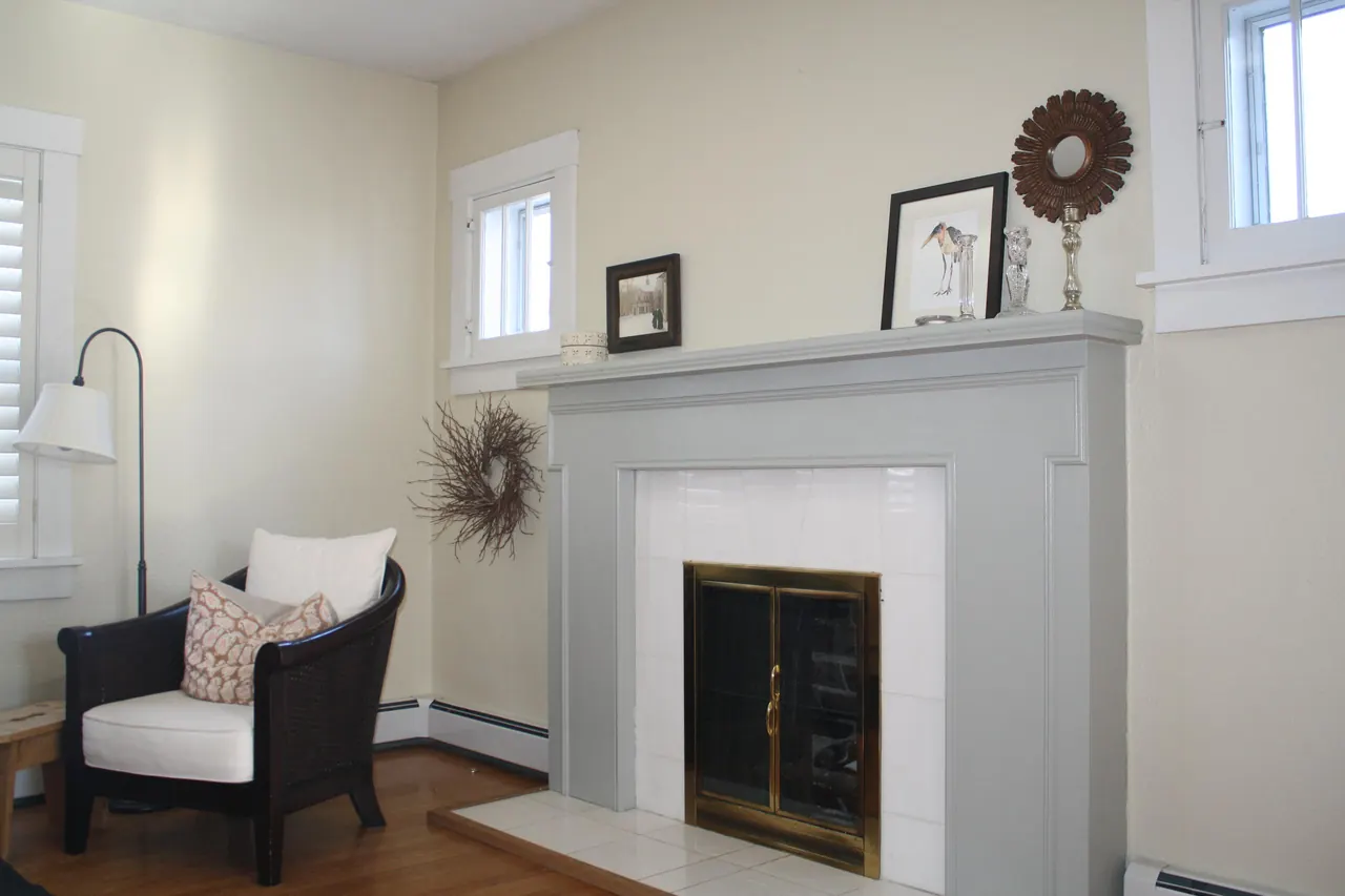 Living room in a historic Denver home, freshly painted walls and fireplace surround