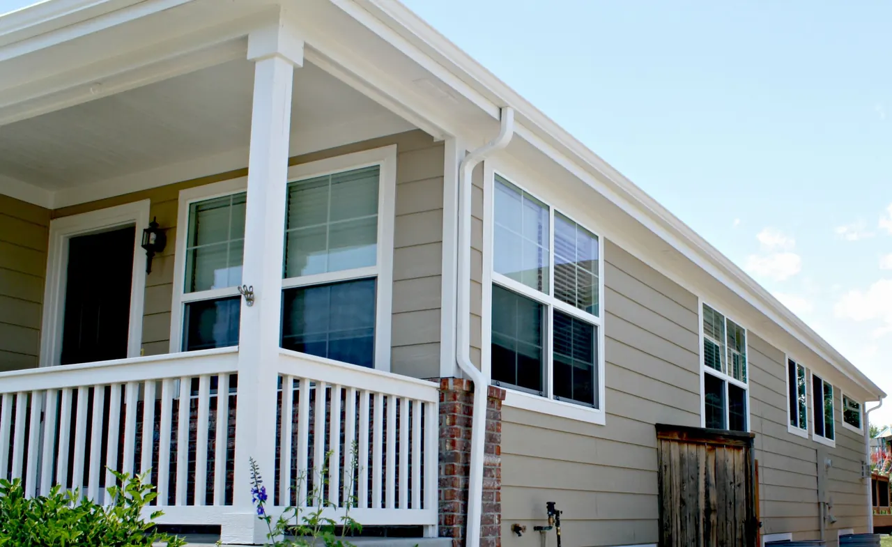 Littleton home repainted with white porch columns and railings