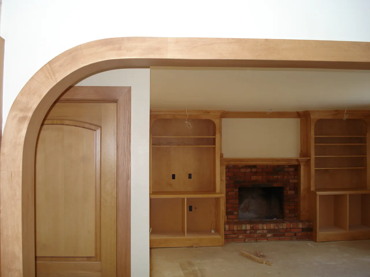 Interior wood trim, arched doorway and built-ins being refinished